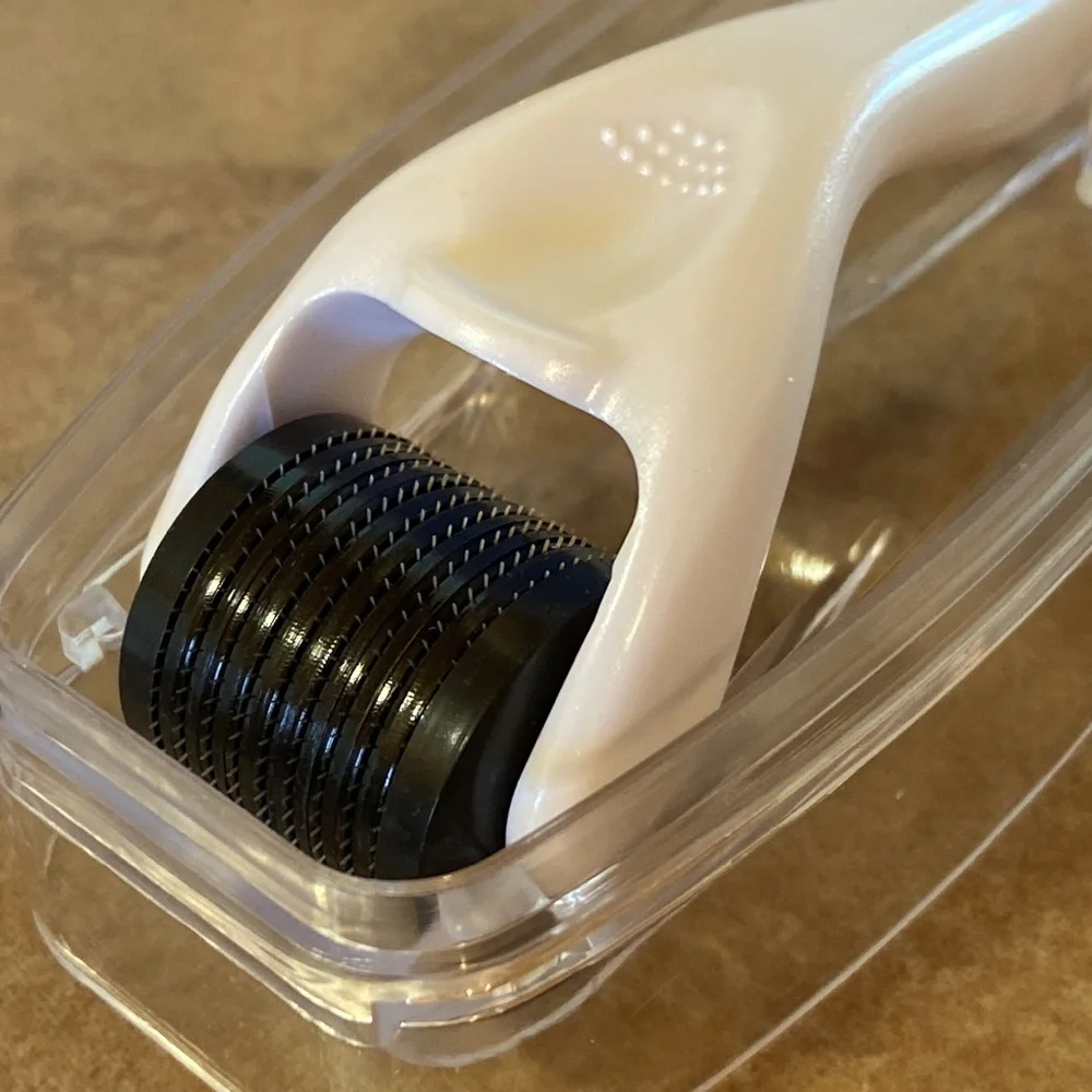 Brookstone Micro Needling Facial Massage Roller in White and Black